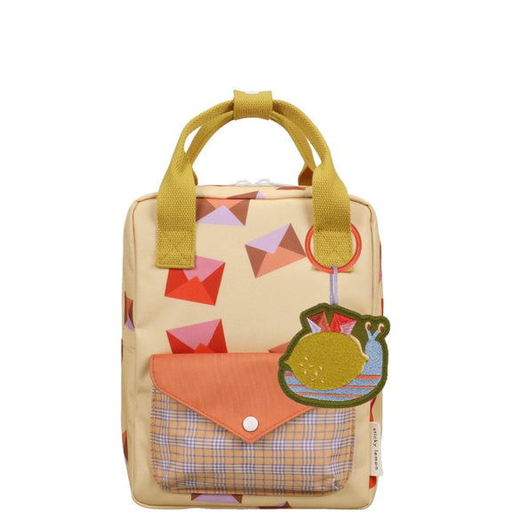 Small backpack with colorful design on a white background