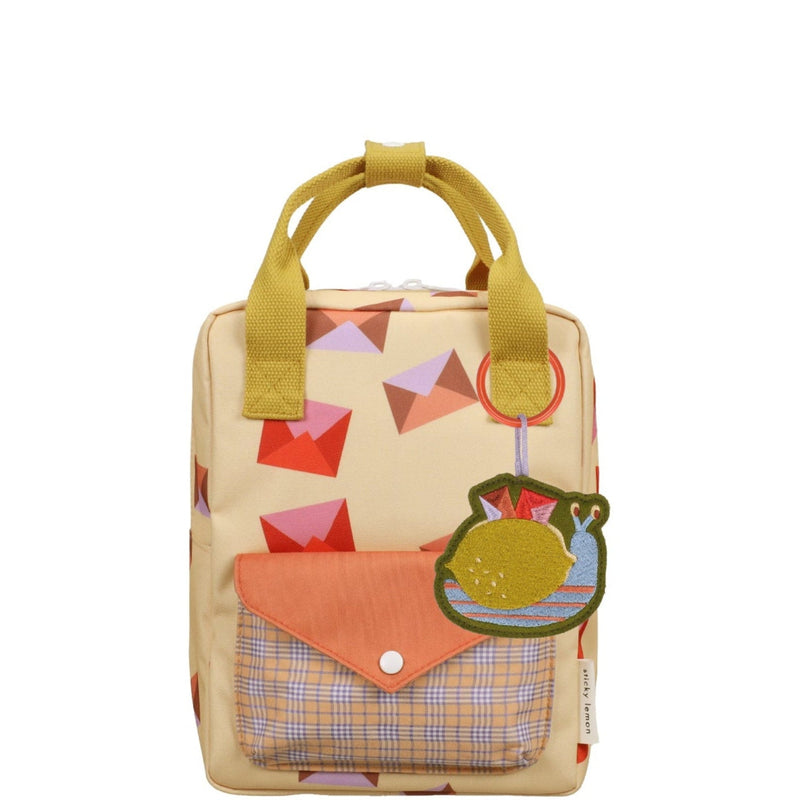 Small backpack with colorful design on a white background