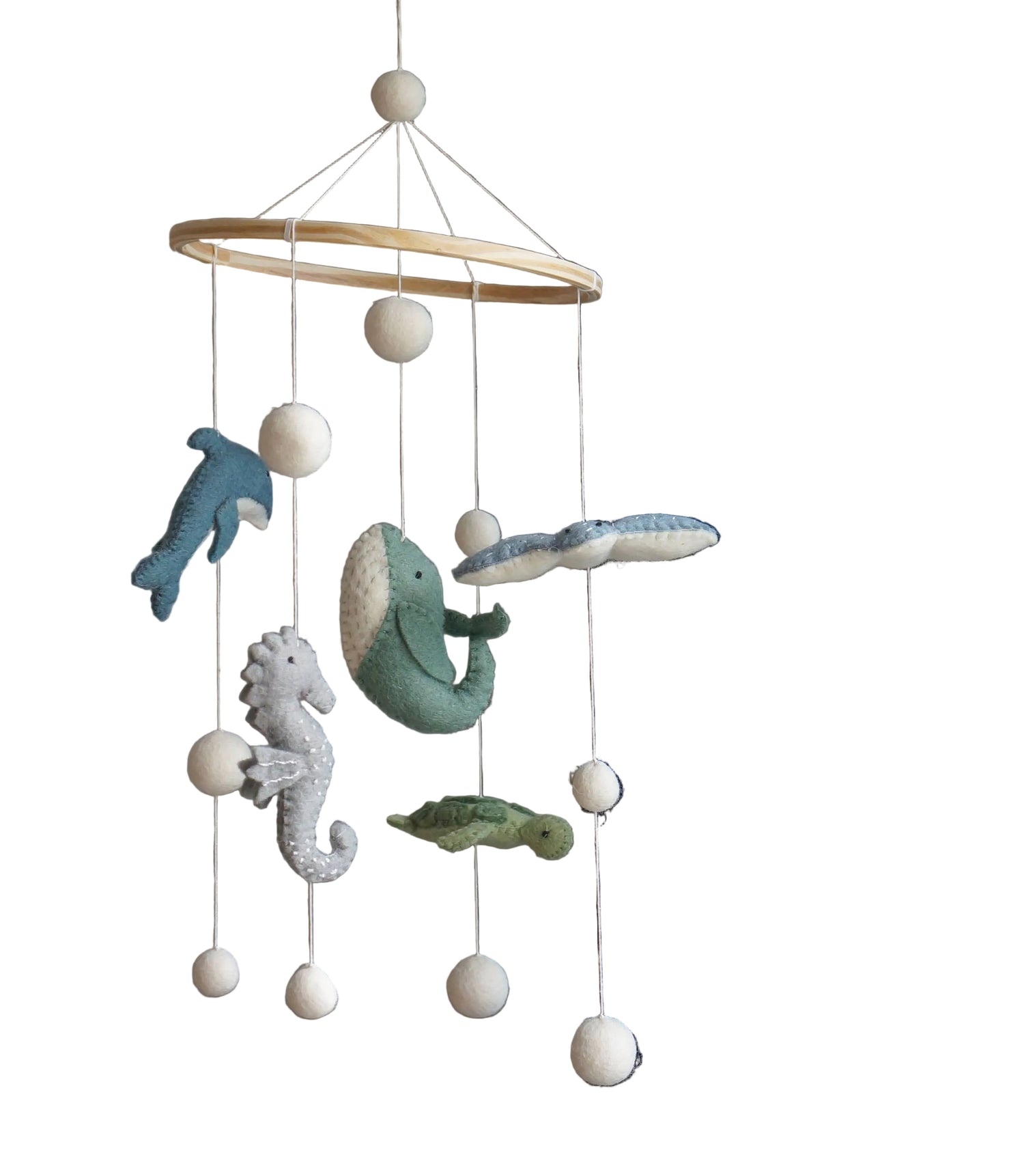 Decorative mobile with sea-themed hanging toys against a neutral background