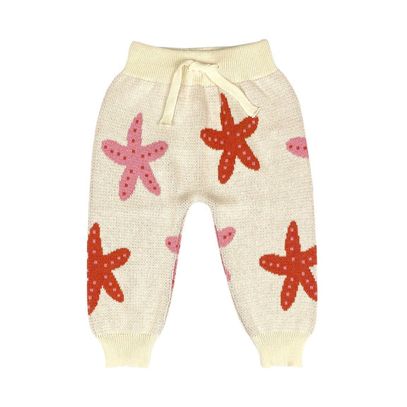 Beige baby pants with starfish patterns on a white background