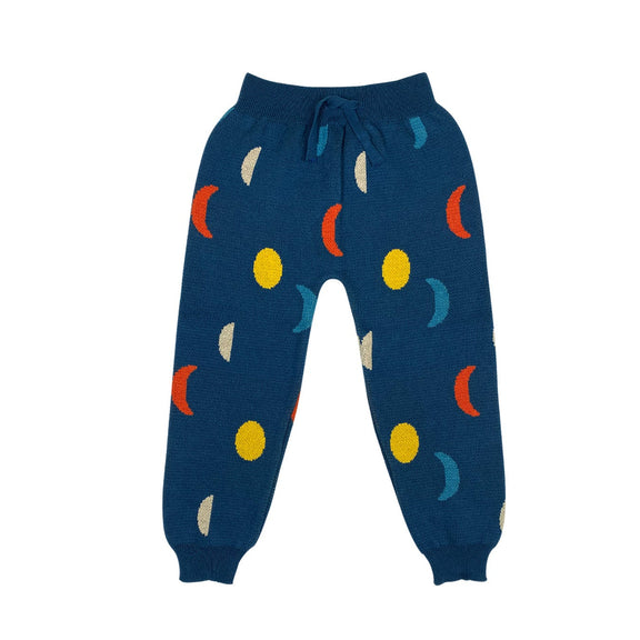 Blue sweatpants with colorful geometric patterns on a white background